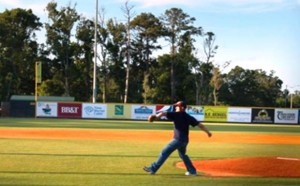Photo by: Cpl. Santiago Colon, Jr. - Lance Cpl. Cory D. Polom, combat correspondent, Cherry Point public affairs, throws the ceremonial first pitch, Morehead City Marlins baseball game